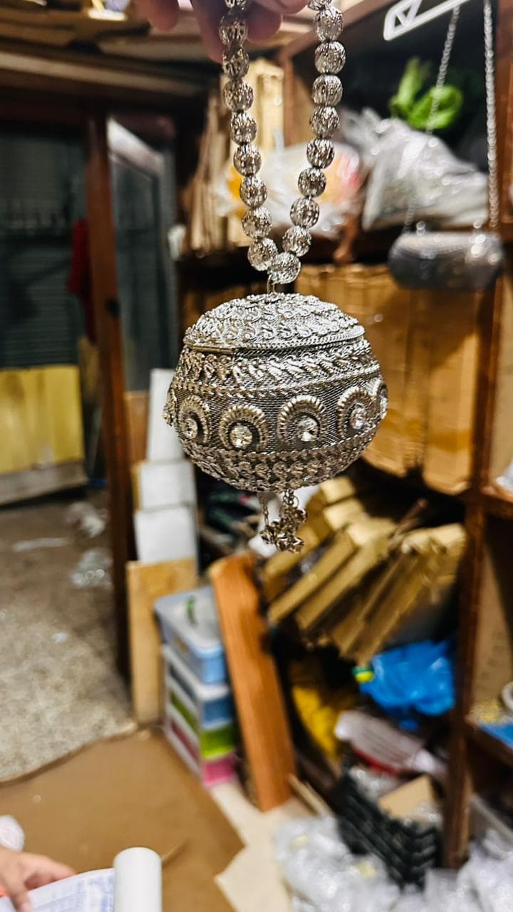 latest metal potli clutch
